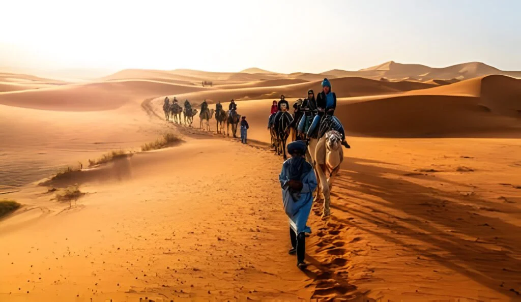 Merzouga-Morocco-Caravan-walking-in-Merzouga-Sahara-desert-on-Morocco