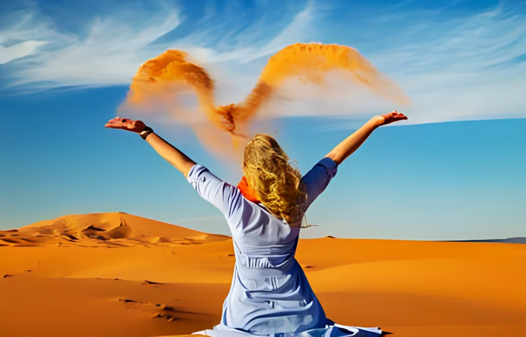 Women in sahara desert in morocco enjoy the moment