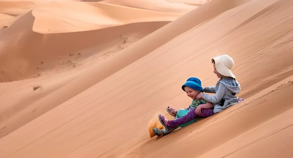 Children playing in the moroccan sahara