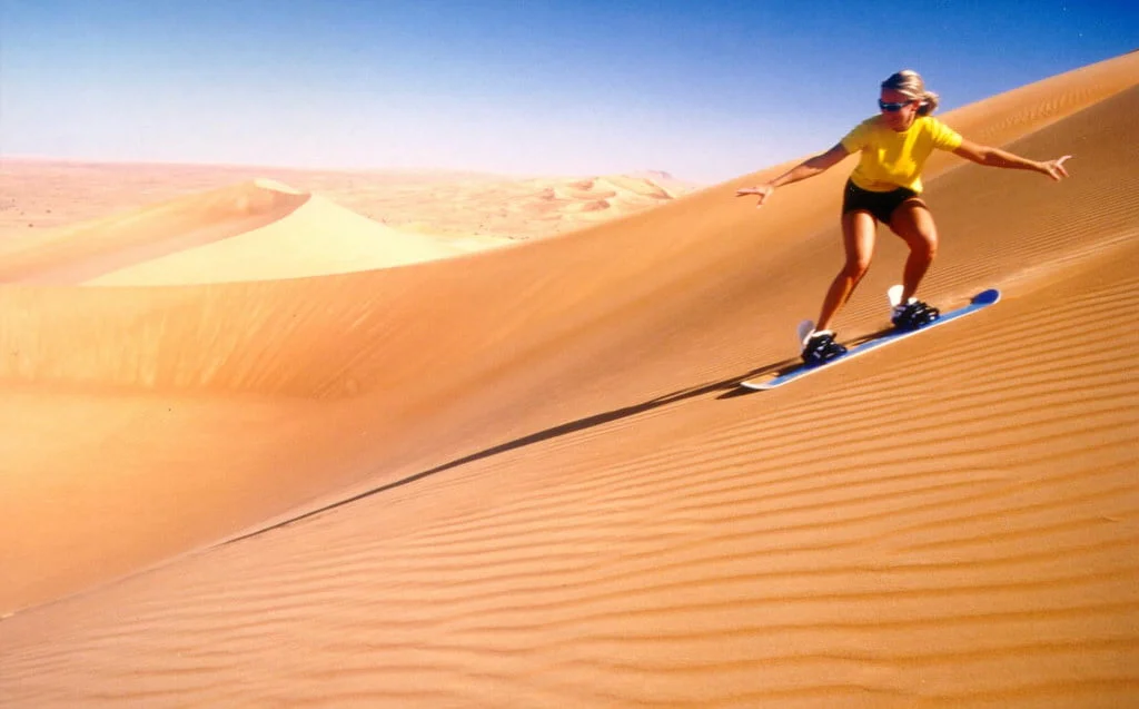 sandboarding in moroccan sahara desert